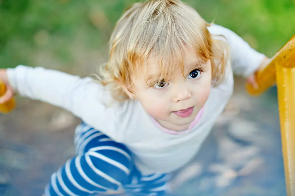 Shot of an adorable little girl playing in a playground Shot of an adorable little girl playing in a playground